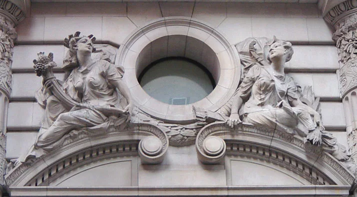 Beaux-Arts building decoration presenting images of the Roman goddesses Pomona and Diana. Note the naturalism of the pos