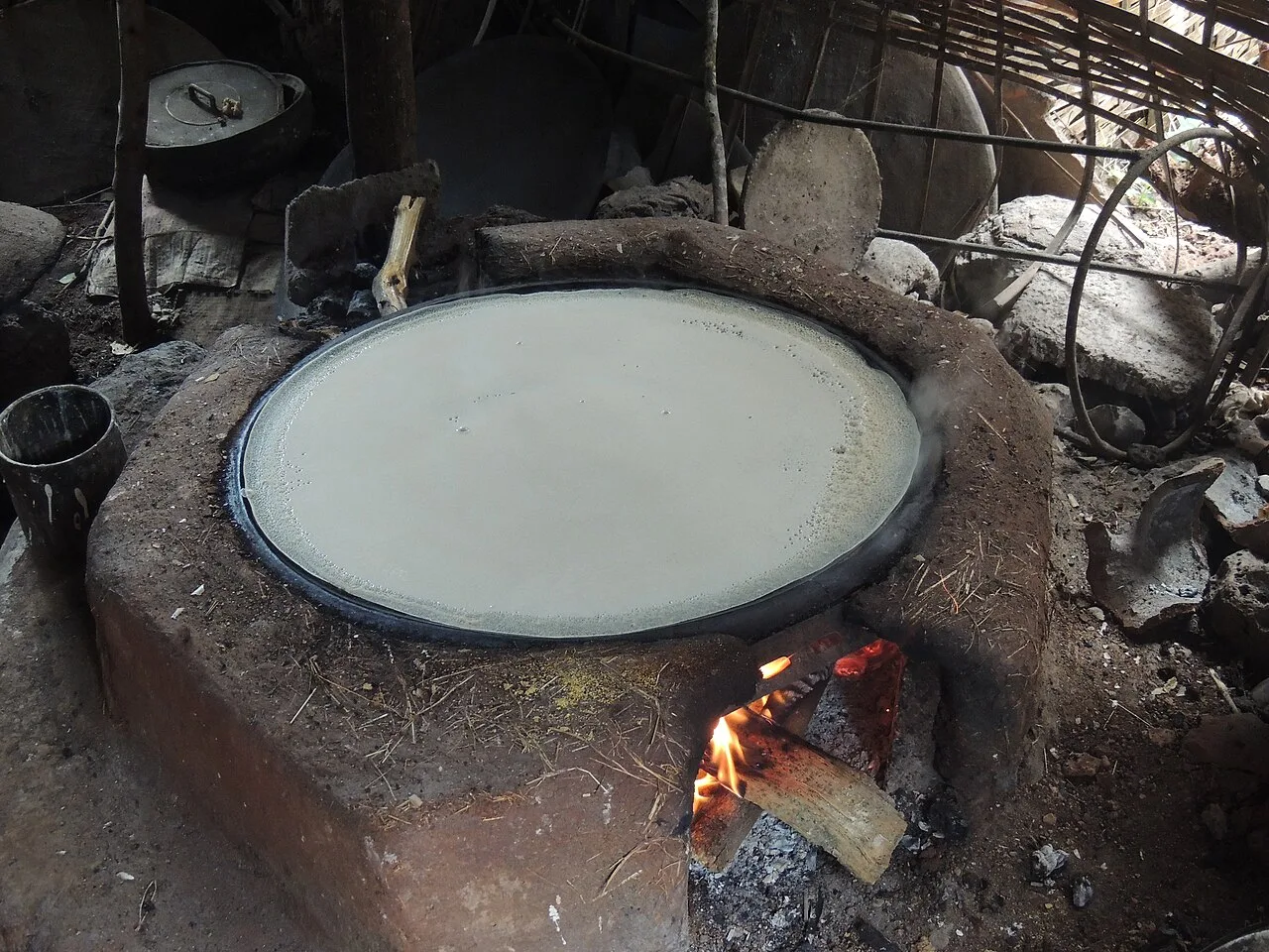 Injera being cooked on a griddle