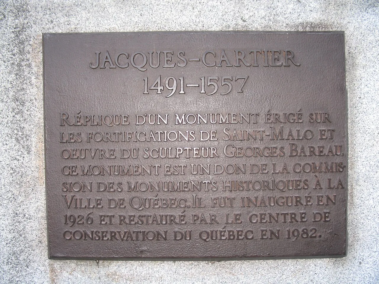 Plaque on the statue of Jacques Cartier in front of the Gabrielle-Roy public library, in the Saint-Roch neighbourhood of