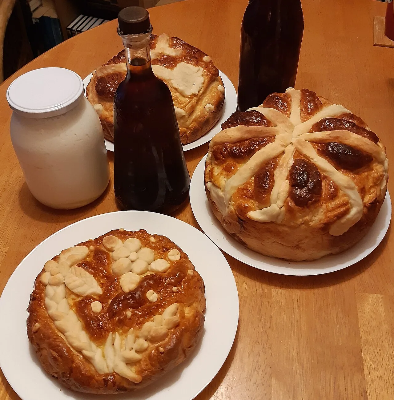 Homemade kefir and kvass served alongside kolach and korovai
