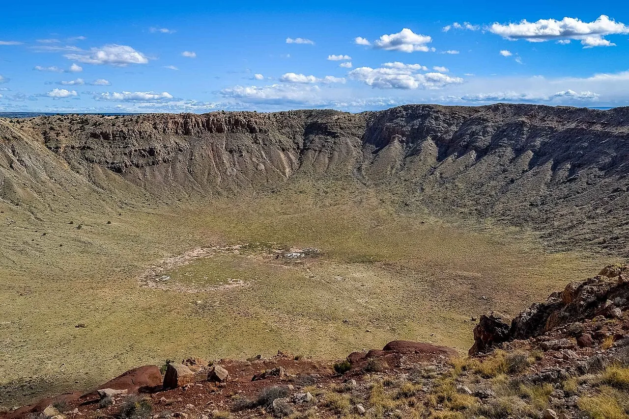 Looking into the crater from the north rim: The rust-colored area on the far (south) rim is where the last drilling for