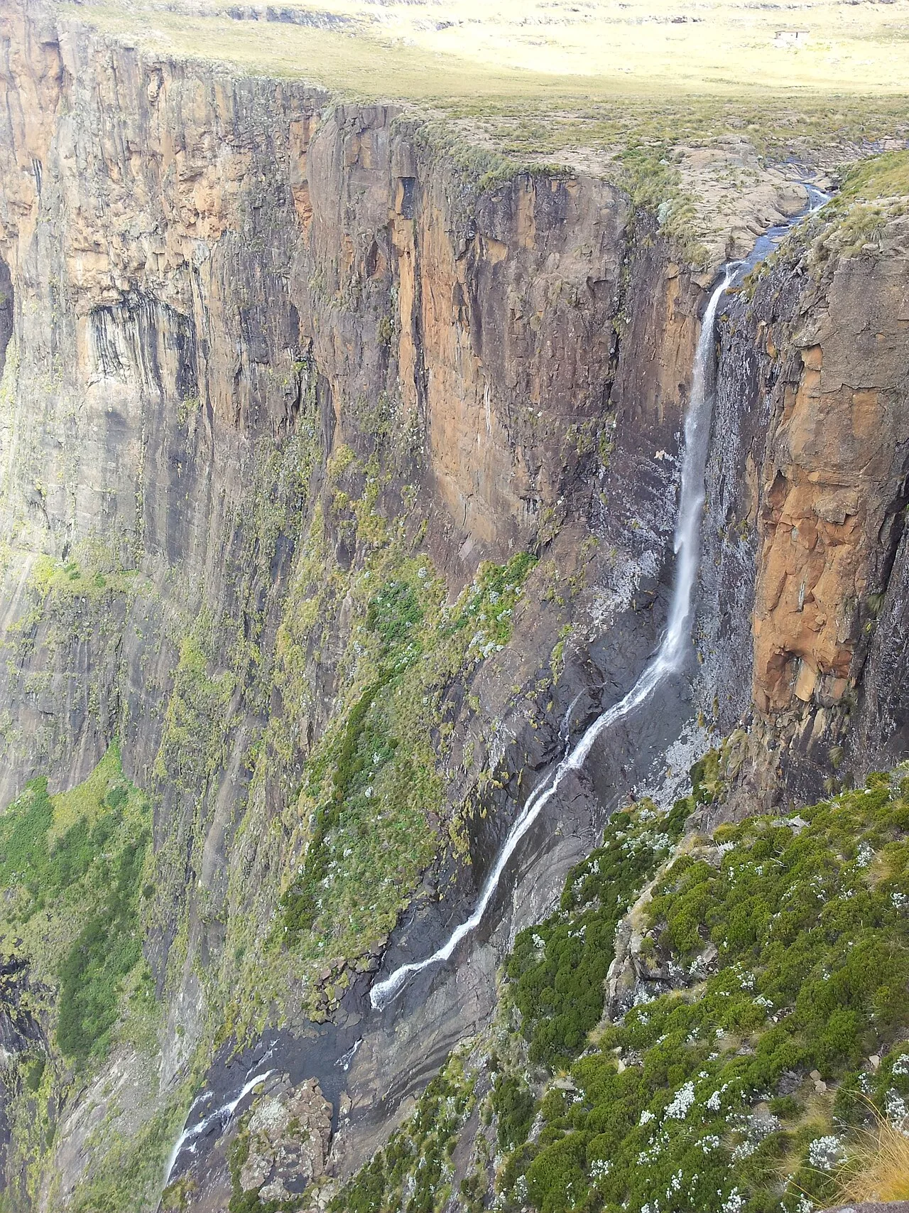 Tugela Falls as it flows off the escarpment showing the first drop and cascade